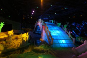 a bridge with a colorful light