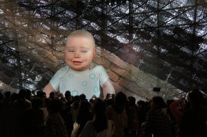 a large group of people watching a baby