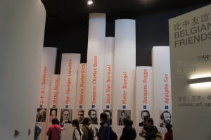 a group of people standing in front of a display