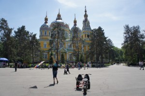 a group of people walking in front of a building