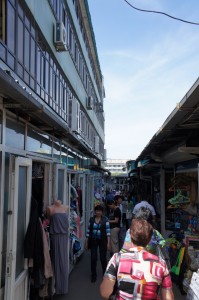 a group of people walking in a market