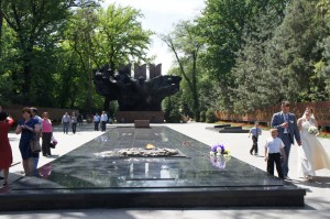 a group of people standing around a monument