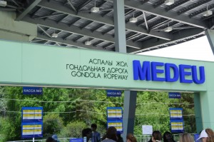 a sign with blue text and green letters