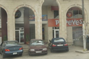 a group of cars parked in front of a building