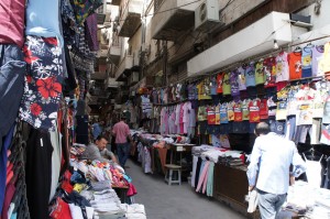 a street market with many clothes