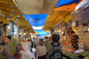 people in a market with many people