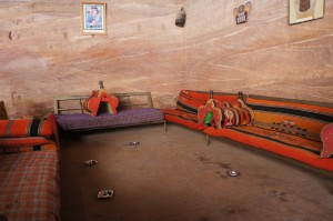 a room with couches and pillows