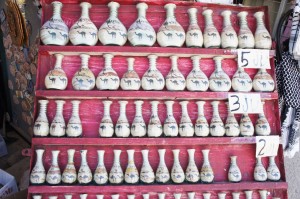 a shelf with vases on it