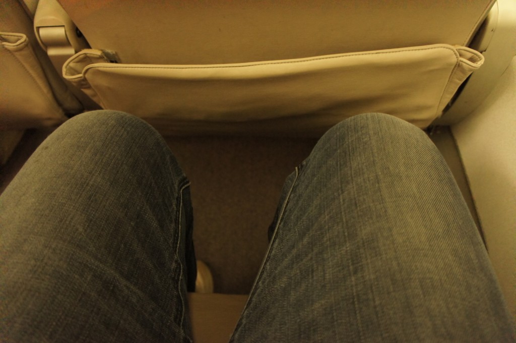 a person's legs and a seat