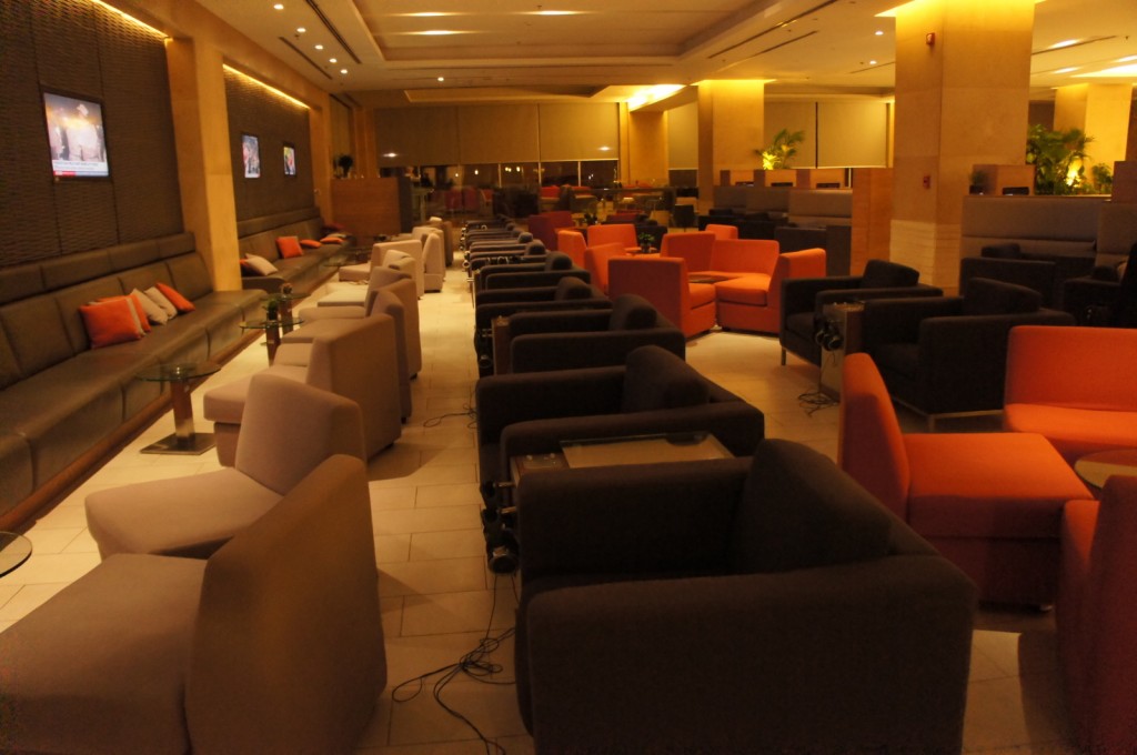 a room with many chairs and tables