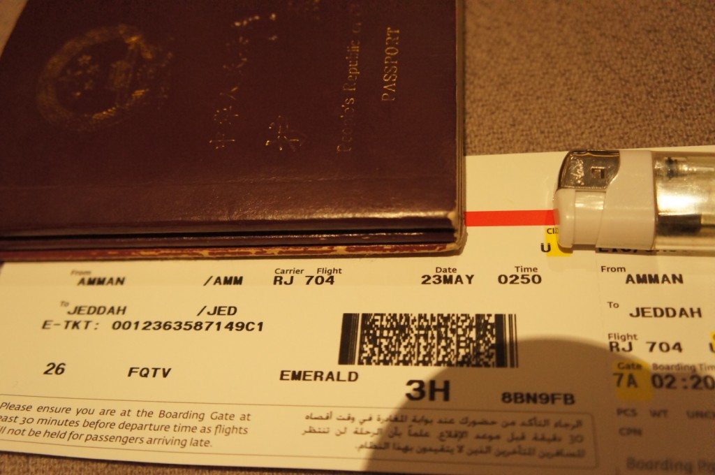 a passport and ticket on a carpet