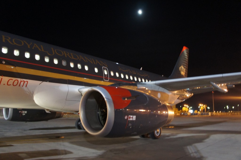 a plane on the runway at night