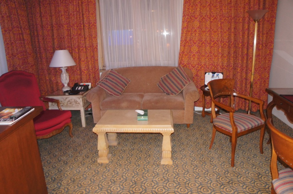 a living room with a couch and chairs