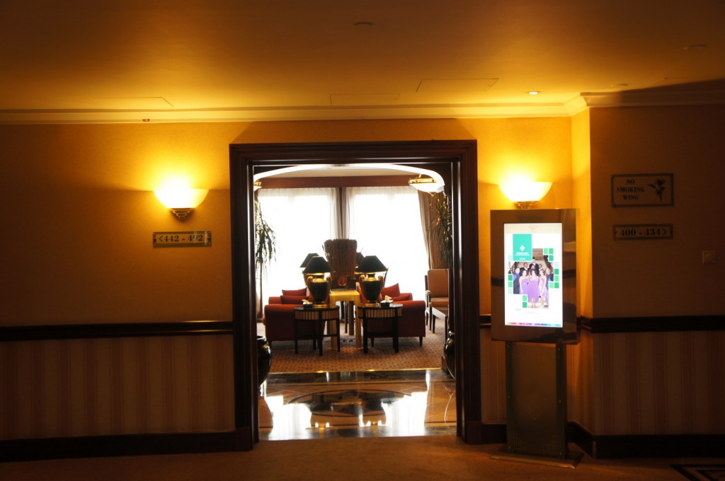 a room with a large door and a large table