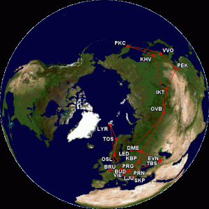 A map of the Earth is shown with various flight routes marked in red lines connecting different cities. The cities are labeled with their respective airport codes, including PKC, VVO, KHV, IKT, OVB, PEK, LYR, TOS, LED, DME, KBP, PRG, EVN, TBS, OSL, BRU, BUD, VIE, PRN, LJU, and SKP. The routes primarily cover parts of Europe and Asia.