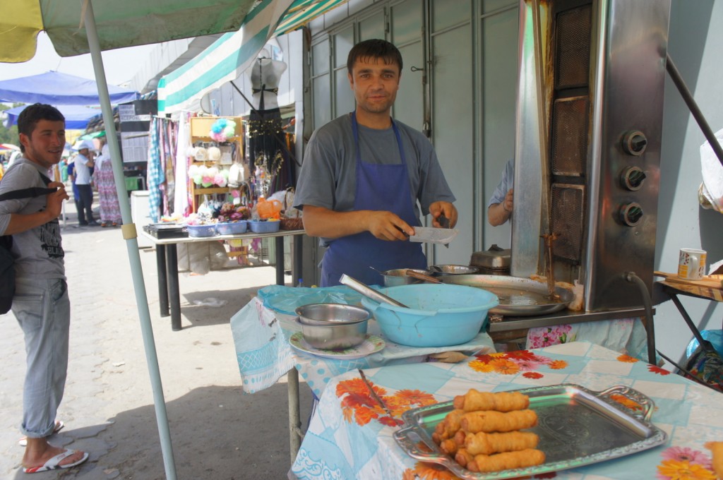 a man in an apron cooking food