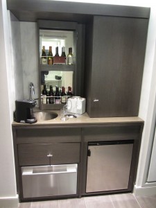 a small kitchen with a sink and a refrigerator