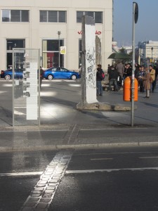 a street with a sign and people walking around
