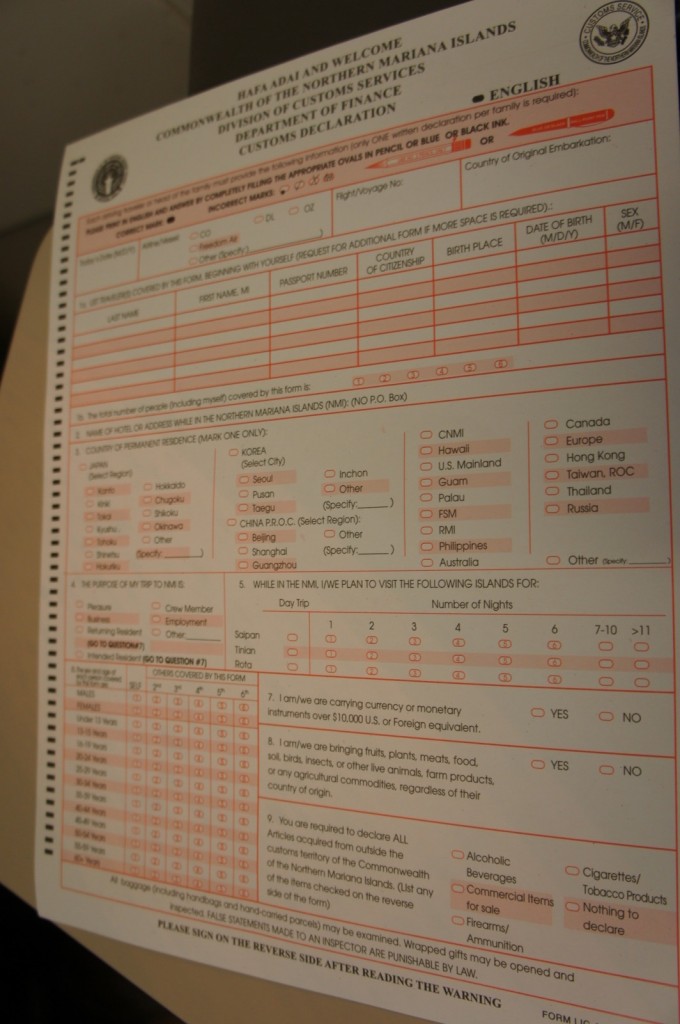 The image shows a customs declaration form for the Commonwealth of the Northern Mariana Islands. The form is titled "HAFA ADAI AND WELCOME COMMONWEALTH OF THE NORTHERN MARIANA ISLANDS DIVISION OF CUSTOMS SERVICES DEPARTMENT OF FINANCE CUSTOMS DECLARATION." It includes sections for personal information such as name, passport number, country of citizenship, and birth date. There are also sections for travel details, purpose of the trip, and items being brought into the country. The form requires the traveler to declare items such as currency over $10,000, fruits, plants, meats, animals, and other goods. There are checkboxes for various declarations, including alcoholic beverages, cigarettes/tobacco products, commercial items for sale, firearms, and ammunition. The form is to be filled out in pencil or blue or black ink, and there is a warning about false statements being punishable by law.
