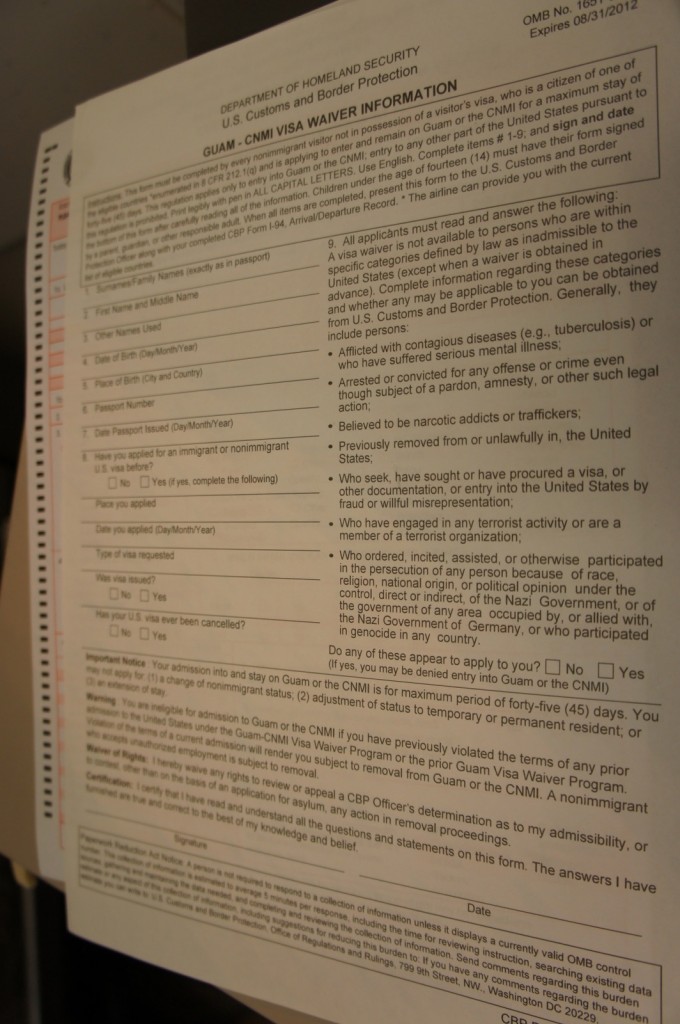 The image shows a form titled "GUAM - CNMI VISA WAIVER INFORMATION" from the U.S. Department of Homeland Security, U.S. Customs and Border Protection. The form is for nonimmigrant visitors who are citizens of certain countries and wish to enter and stay in Guam or the Commonwealth of the Northern Mariana Islands (CNMI) for a maximum period of 45 days without a visa. The form includes fields for personal information such as name, date of birth, passport details, and questions regarding eligibility and previous visa history. There are also sections with important notices and a declaration to be signed by the applicant.