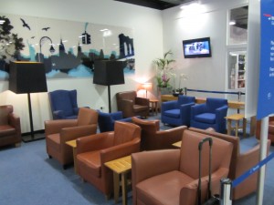 a room with chairs and a tv
