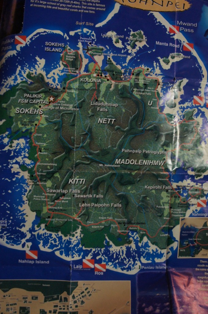 This image is a detailed map of Pohnpei, an island in the Federated States of Micronesia. The map highlights various regions, landmarks, and points of interest on the island, including:
- Major areas such as Sokehs, Kolonia, Nett, Kitti, and Madolenihmw.
- Notable sites like Palikir (FSM Capital), Pohnpei International Airport, and the College of Micronesia.
- Natural attractions such as Liduduhniap Falls, Sawarlap Falls, Sawartik Falls, Lehn Paipohn Falls, and Kepirohi Falls.
- Islands and passes around Pohnpei, including Sokehs Island, Nahnpwutao Island, Mwand Pass, and Nahning Island.
- Various other points of interest like Pohnpaip Petroglyphs, Pohnpei Botanical Garden, and several surf sites.
The map also includes symbols indicating dive sites and other recreational areas.