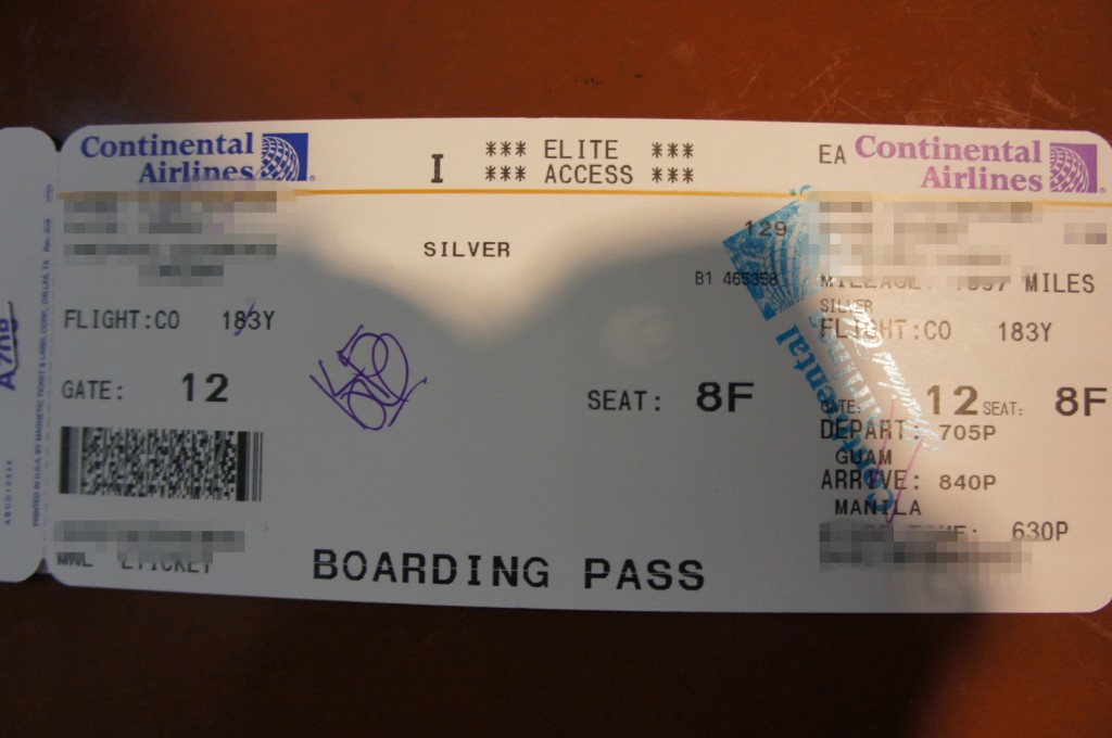 a close-up of a boarding pass