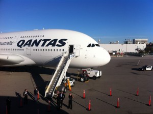 a large white airplane with a ladder