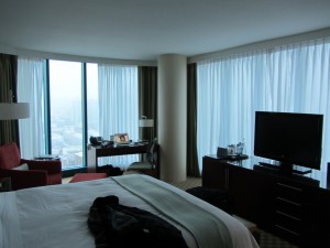 a bedroom with a television and a bed