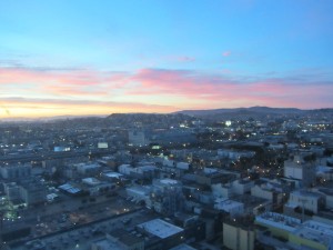 a cityscape with a sunset