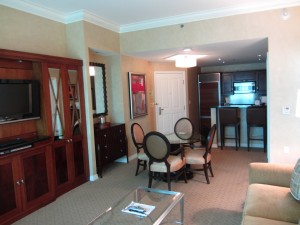 a living room with a couch and dining table