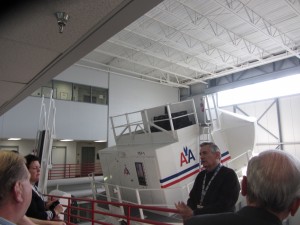 a group of people looking at a large white object