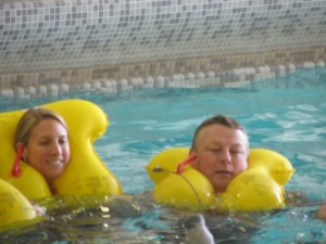 a man and woman in a pool