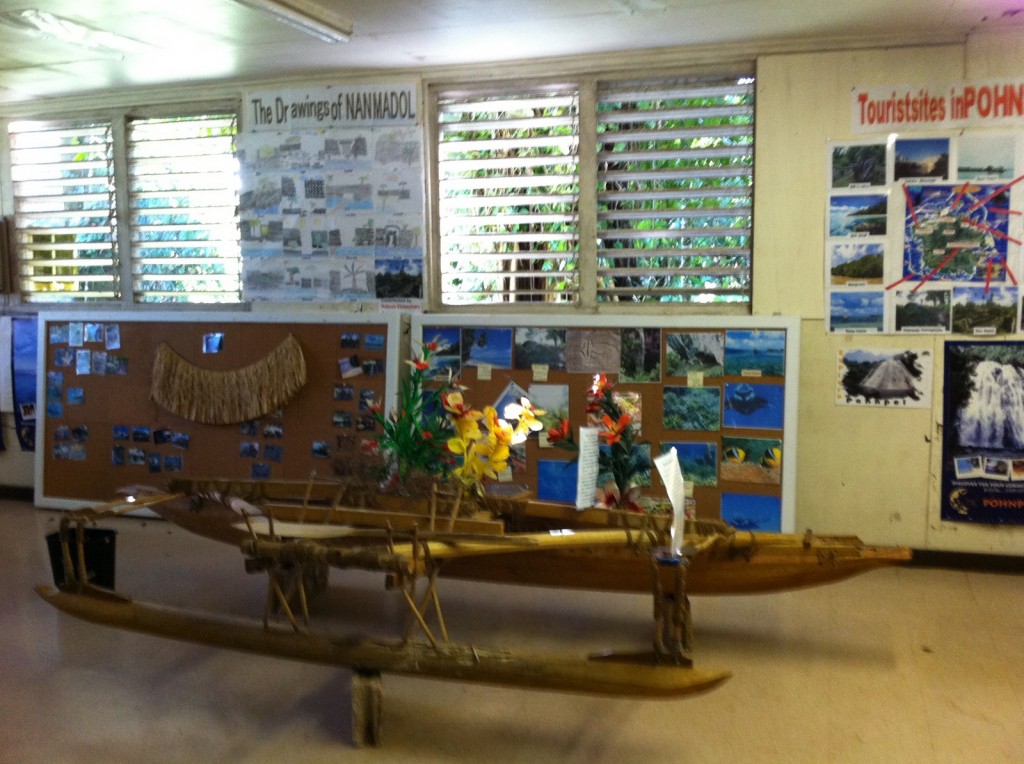 a wooden boat in a classroom
