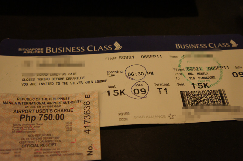 The image shows a business class boarding pass for a Singapore Airlines flight and an airport user's charge receipt. The boarding pass indicates a flight from Manila (MNL) to Singapore (SIN) on flight number SQ921, dated 06 September. The boarding time is 6:30 PM, and the seat number is 15K at gate 09 in terminal T1. The boarding pass also mentions an invitation to the Silver Kris Lounge. The airport user's charge receipt from the Manila International Airport Authority shows a fee of Php 750.00.
