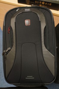 a black suitcase with a red logo