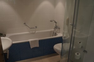 a bathroom with a bathtub and toilet
