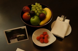 a bowl of fruit and a plate of strawberries