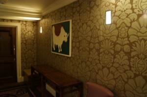 a room with a picture of a bull