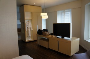 a room with a television and a robe