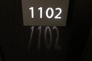 a white sign with numbers on it