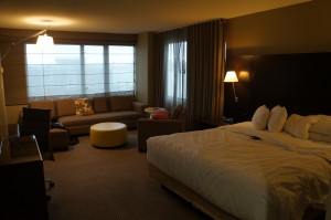 a hotel room with a bed and a couch