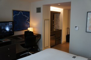 a room with a bed and a desk