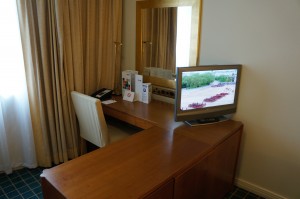 a desk with a television on it