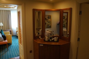 a bathroom with a mirror and a teapot