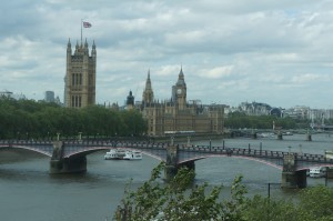 a bridge over a river with a castle in the background