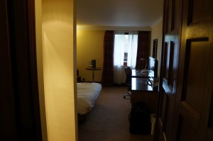 a room with a bed and desk