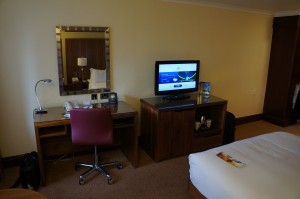 a room with a bed and a tv