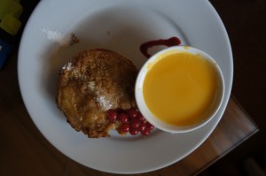 a plate of food and a cup of liquid