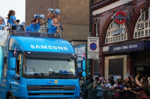 a group of people on top of a truck